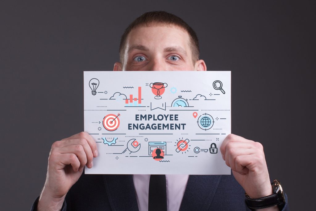Professional holding diagram illustrating employee engagement strategies and workplace satisfaction concepts