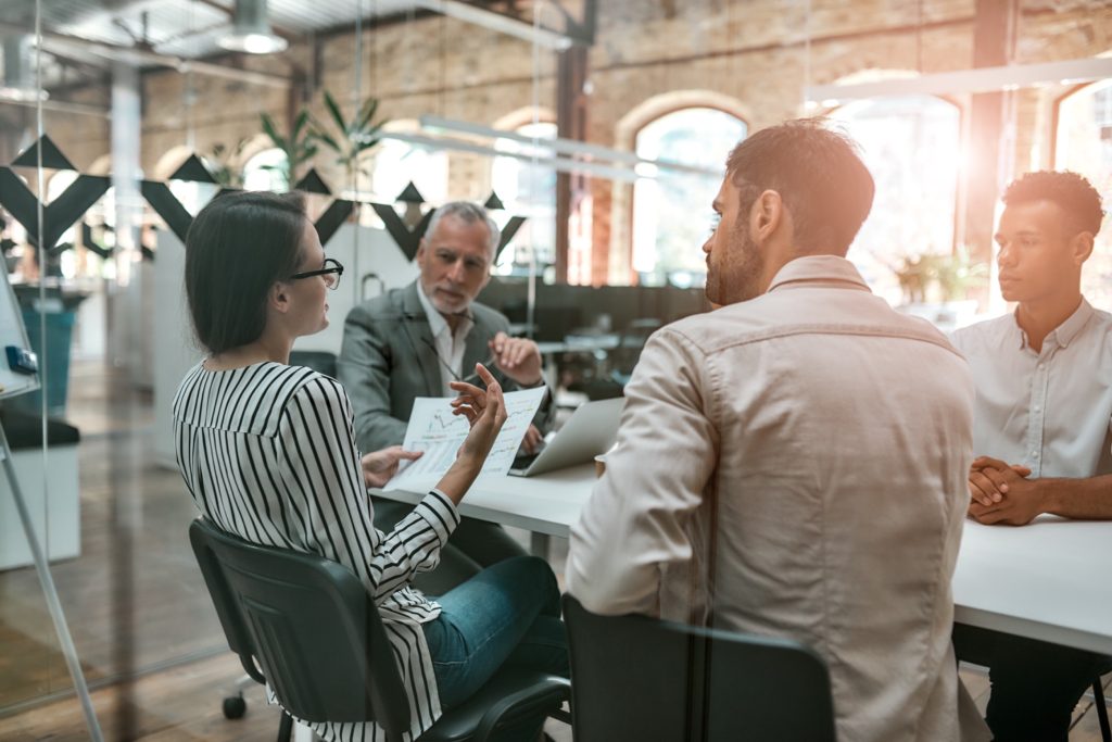 Business team discussing strategy in modern office setting