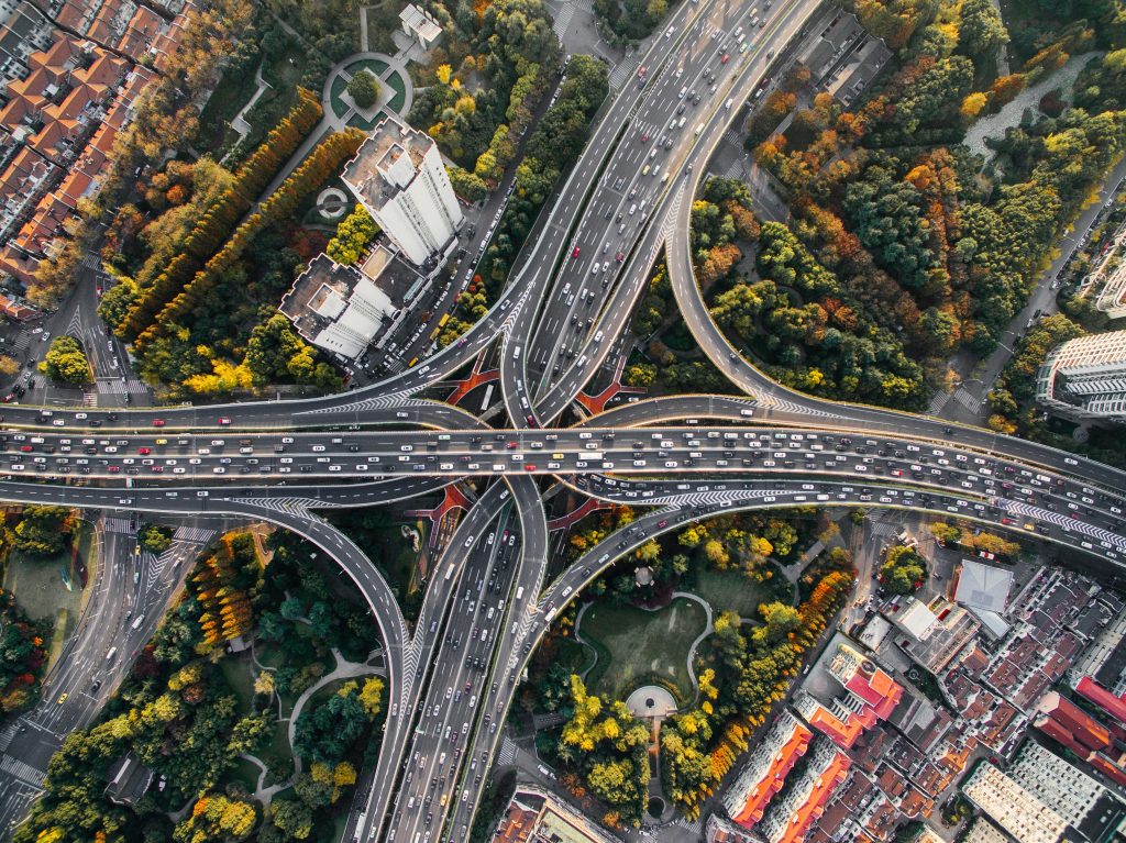 Aerial view of interconnected highway interchange with multiple lanes and exit ramps