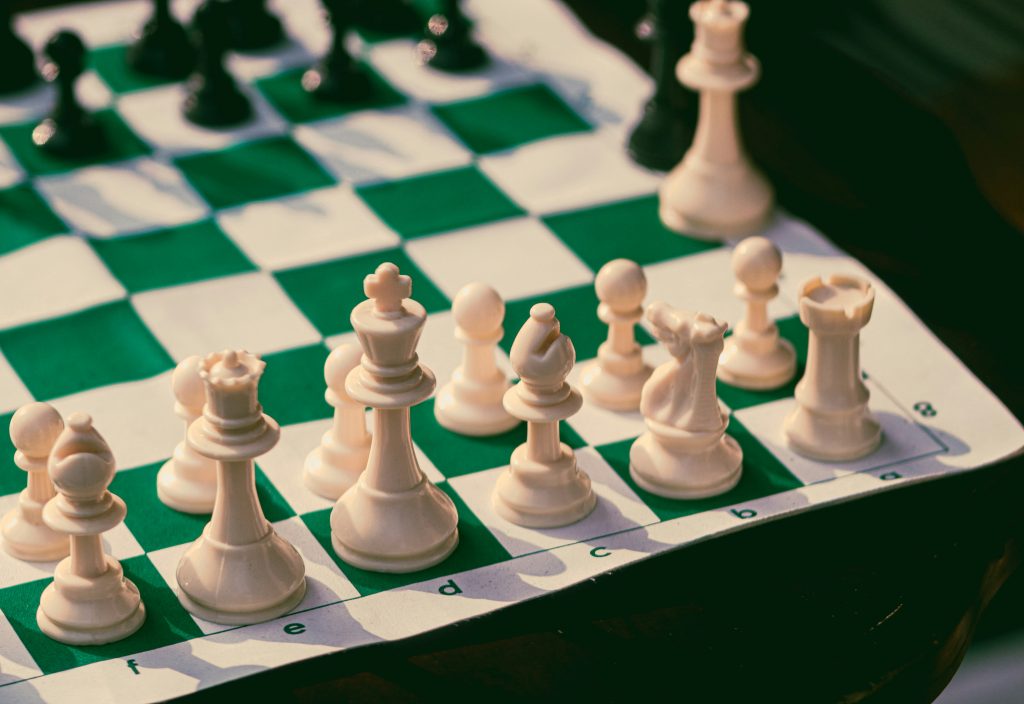 Chess pieces on board representing strategic business planning and decision-making