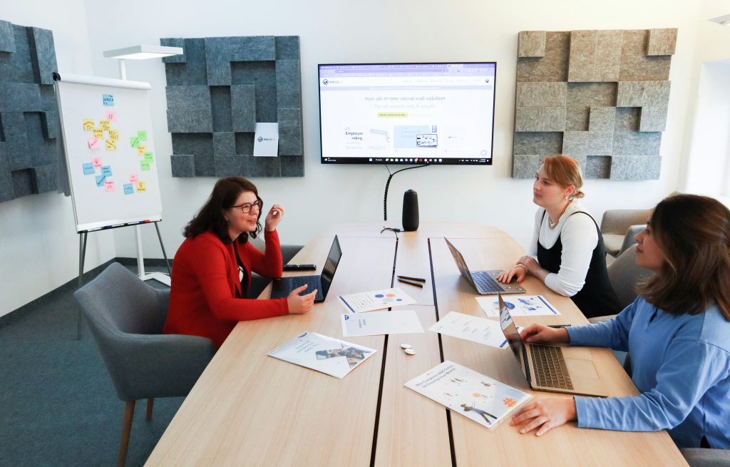 Professional team meeting in modern office workspace discussing delegation and business growth strategies