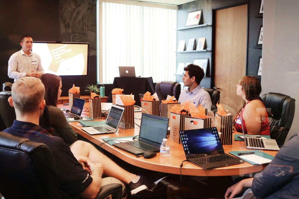 Business team in meeting discussing execution and accountability practices