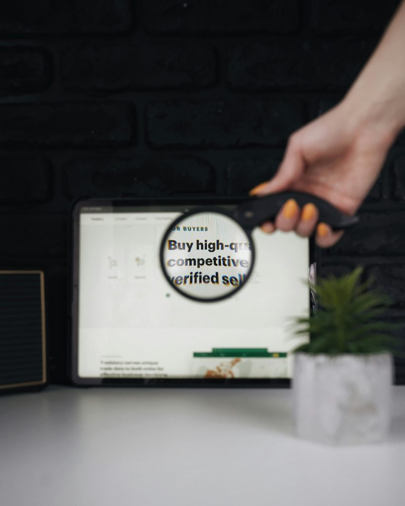 Hand circling "buy high-commitment product" text on whiteboard with customer insights notes