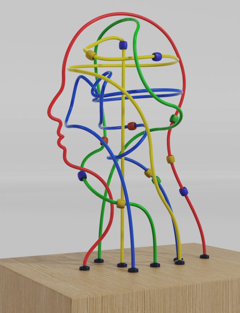 Abstract sculpture of colorful wires forming a human head profile, representing interconnected thinking patterns and mental